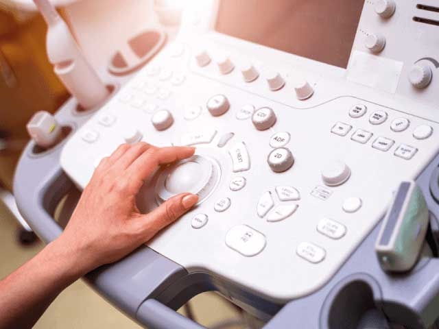 Hand operating control panel on medical equipment with encoder technology